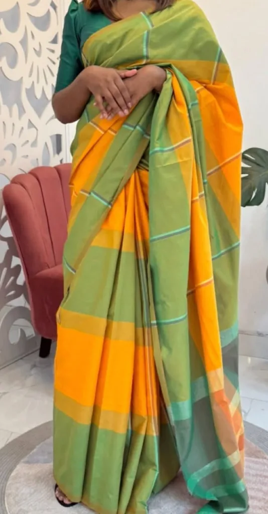 A handloom cotton saree, draped